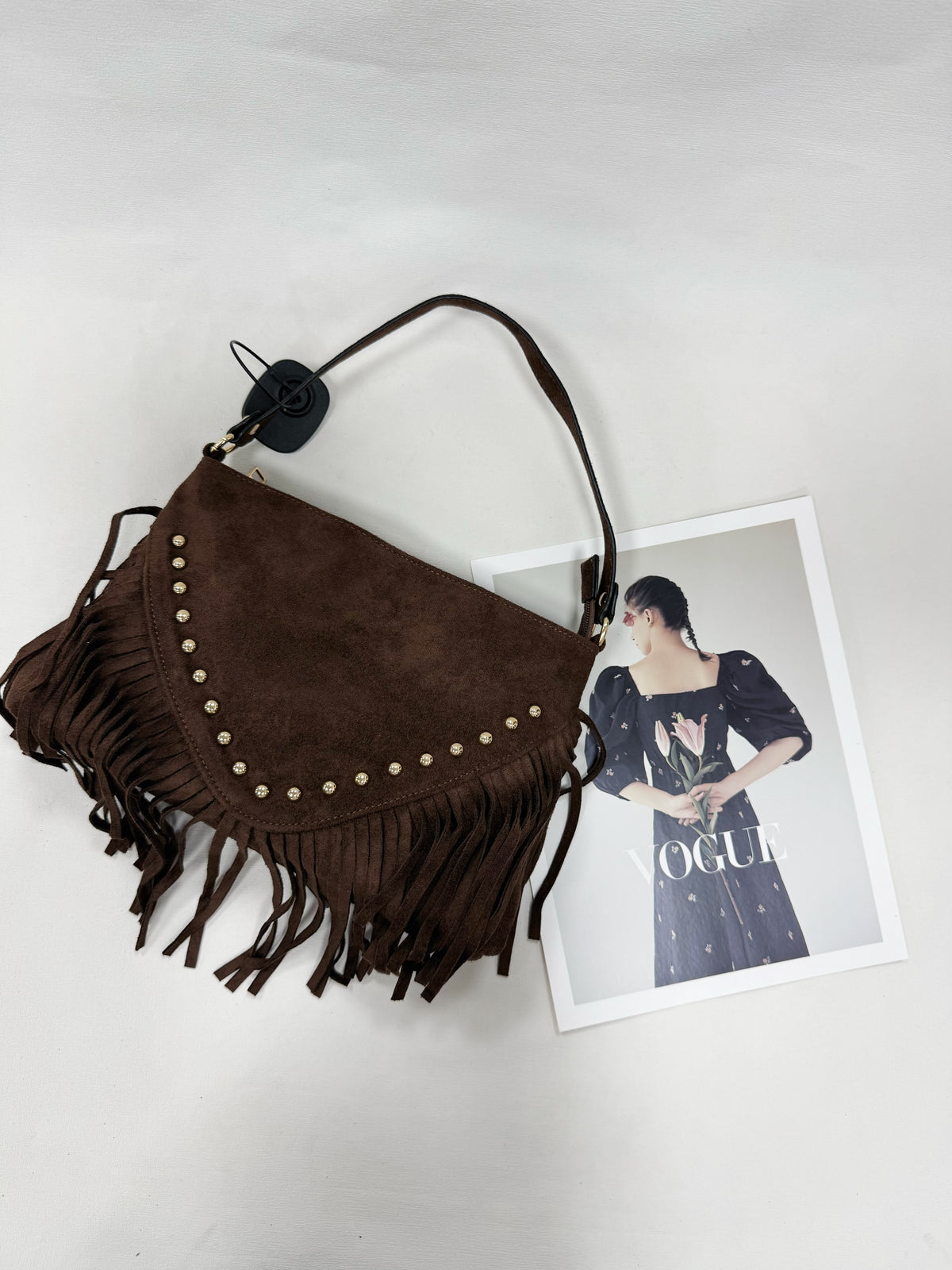 BORSA SCAMOSCIATA CON BORCHIE E FRANGE