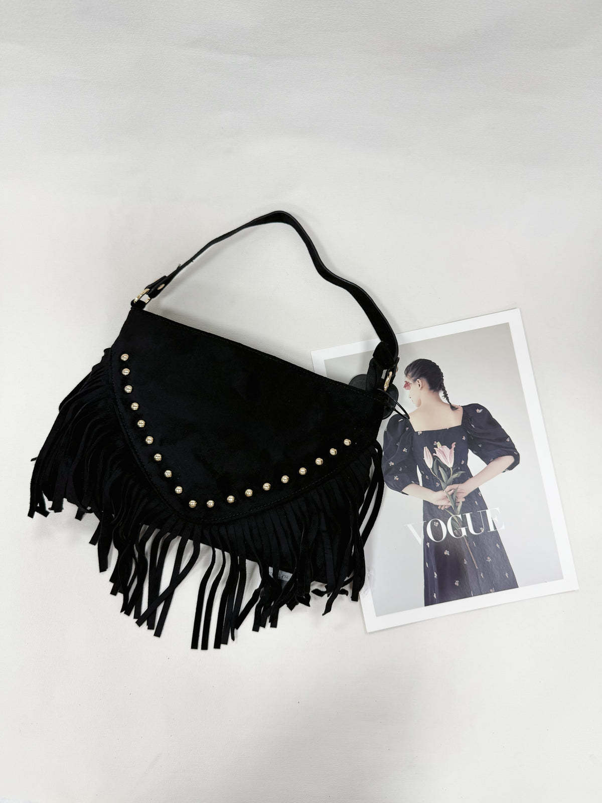 BORSA SCAMOSCIATA CON BORCHIE E FRANGE